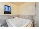 Large bathroom with tiled surround and spa tub at 1430 Red Rock Dr, Pahrump, NV 89048