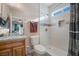 Well lit bathroom featuring a walk-in shower with white tile surround at 1430 Red Rock Dr, Pahrump, NV 89048