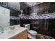 Modern bathroom featuring dark textured tile, chrome fixtures, and neutral vanity at 1430 Red Rock Dr, Pahrump, NV 89048
