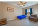 Bedroom with ceiling fan, window and comfortable chair at 1430 Red Rock Dr, Pahrump, NV 89048