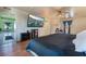 Cozy bedroom with hardwood floors, large TV, and decorative fireplace at 1430 Red Rock Dr, Pahrump, NV 89048