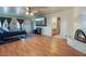 Relaxing bedroom with hardwood floors, large TV, and en-suite bathroom at 1430 Red Rock Dr, Pahrump, NV 89048