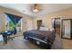 Bedroom with ensuite, large window, and walk in closet at 1430 Red Rock Dr, Pahrump, NV 89048