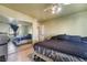Bedroom with closet, window, and ceiling fan at 1430 Red Rock Dr, Pahrump, NV 89048
