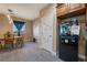 View of kitchen featuring dining nook, wooden cabinetry and black refrigerator at 1430 Red Rock Dr, Pahrump, NV 89048