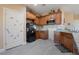 Well-lit kitchen features wooden cabinetry, stainless steel appliances, and granite countertops at 1430 Red Rock Dr, Pahrump, NV 89048