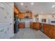 Bright kitchen features wooden cabinetry, stainless steel appliances, and granite countertops at 1430 Red Rock Dr, Pahrump, NV 89048