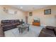 Comfortable living room with stylish decor, leather sofas and a glass coffee table at 1430 Red Rock Dr, Pahrump, NV 89048