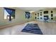 Bright living room features hardwood floors, window, and unique wall decorations at 1430 Red Rock Dr, Pahrump, NV 89048