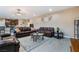 Cozy living room with leather sofas, neutral walls, and light wood-look floors at 1430 Red Rock Dr, Pahrump, NV 89048