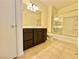 Modern bathroom featuring a large vanity, glass shower doors, and tile floors at 9050 W Warm Springs Rd # 1016, Las Vegas, NV 89148