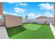 Backyard with putting green and storage shed at 4657 Warner Pl, Las Vegas, NV 89115