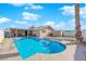 Large kidney shaped pool in sunny backyard at 4657 Warner Pl, Las Vegas, NV 89115