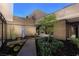 Modern home showcasing an outdoor space with a garden, water feature, and cacti at 607 Alpine Summit Dr, Henderson, NV 89012