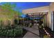 Contemporary home with a beautifully landscaped front yard, a water feature, and modern design at 607 Alpine Summit Dr, Henderson, NV 89012