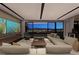 Spacious living room featuring modern decor and a stunning view of the city skyline at 607 Alpine Summit Dr, Henderson, NV 89012