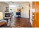 Open-concept living room with wood floors, fireplace, and seamless transition to the dining area at 1050 E Cactus Ave # 2104, Las Vegas, NV 89183