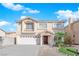 Charming two-story home featuring a well-manicured lawn and a two-car garage at 10568 Salmon Leap St, Las Vegas, NV 89183