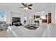 Spacious living area with a white sofa and open view to the kitchen and dining area at 10568 Salmon Leap St, Las Vegas, NV 89183