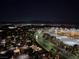 Night aerial view with city lights and mountain backdrop at 9101 Alta Dr # 902, Las Vegas, NV 89145