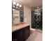 Elegant bathroom with dark vanity and shower at 9101 Alta Dr # 902, Las Vegas, NV 89145