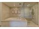 Luxurious bathroom featuring a soaking tub and glass shower at 9101 Alta Dr # 902, Las Vegas, NV 89145