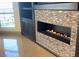 Elegant fireplace with mosaic tile surround and built-in shelving at 9101 Alta Dr # 902, Las Vegas, NV 89145