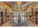 Elegant building lobby with ornate fireplace and chandelier at 9101 Alta Dr # 902, Las Vegas, NV 89145