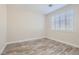 Clean bedroom with window shutters and wood look floors at 10315 Premia Pl, Las Vegas, NV 89135
