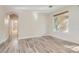Bright bedroom with hardwood floors and view of outdoor space at 10315 Premia Pl, Las Vegas, NV 89135