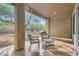 Cozy covered patio with outdoor seating perfect for enjoying the backyard view at 10315 Premia Pl, Las Vegas, NV 89135