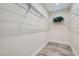 Organized walk-in closet with ample shelving and neutral walls at 10315 Premia Pl, Las Vegas, NV 89135