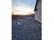 Gravel backyard with desert landscape featuring a sunset sky at 4780 Horizon Ave, Pahrump, NV 89060