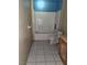 Modest bathroom featuring a bathtub, toilet, and outdated tile flooring at 4780 Horizon Ave, Pahrump, NV 89060