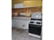 Kitchen area with outdated cabinets and appliances at 4780 Horizon Ave, Pahrump, NV 89060