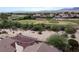 Aerial view of the property, highlighting the landscaped backyard and proximity to the golf course at 1214 Country Club Dr, Laughlin, NV 89029
