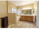 Well-lit bathroom offering double sinks and a soaking tub at 1214 Country Club Dr, Laughlin, NV 89029