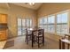 Dining area featuring a table with four chairs and several windows for natural light at 1214 Country Club Dr, Laughlin, NV 89029