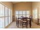 Dining area featuring a table with four chairs and several windows for natural light at 1214 Country Club Dr, Laughlin, NV 89029