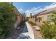 Well-maintained pathway between houses, showcasing desert landscaping and privacy walls at 1214 Country Club Dr, Laughlin, NV 89029