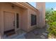 Charming front door entrance with a 'welcome' mat, desert landscaping, and a serene atmosphere at 1214 Country Club Dr, Laughlin, NV 89029