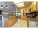 Modern kitchen with granite countertops, stainless steel appliances, and tile flooring at 1214 Country Club Dr, Laughlin, NV 89029
