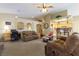 Open-concept living room with modern lighting, comfortable furniture and neutral color palette at 1214 Country Club Dr, Laughlin, NV 89029