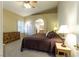 Comfortable bedroom showcasing a ceiling fan and natural light at 1214 Country Club Dr, Laughlin, NV 89029