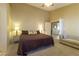 Relaxing bedroom featuring a ceiling fan and tile flooring at 1214 Country Club Dr, Laughlin, NV 89029