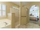 Bathroom featuring a luxurious step-in shower and soaking tub at 1214 Country Club Dr, Laughlin, NV 89029