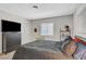 Inviting bedroom featuring comfortable bed, modern furnishings, and neutral-toned carpet at 2213 W Oakey Blvd, Las Vegas, NV 89102