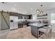 Modern kitchen features stainless steel appliances, granite countertops, and a breakfast bar with seating at 2213 W Oakey Blvd, Las Vegas, NV 89102