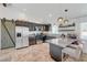 Well-equipped kitchen with stainless steel appliances, sleek dark cabinetry, and a breakfast bar at 2213 W Oakey Blvd, Las Vegas, NV 89102