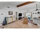 Bright living room with vaulted ceilings, exposed beam, and tile flooring creates a warm and inviting atmosphere at 2213 W Oakey Blvd, Las Vegas, NV 89102